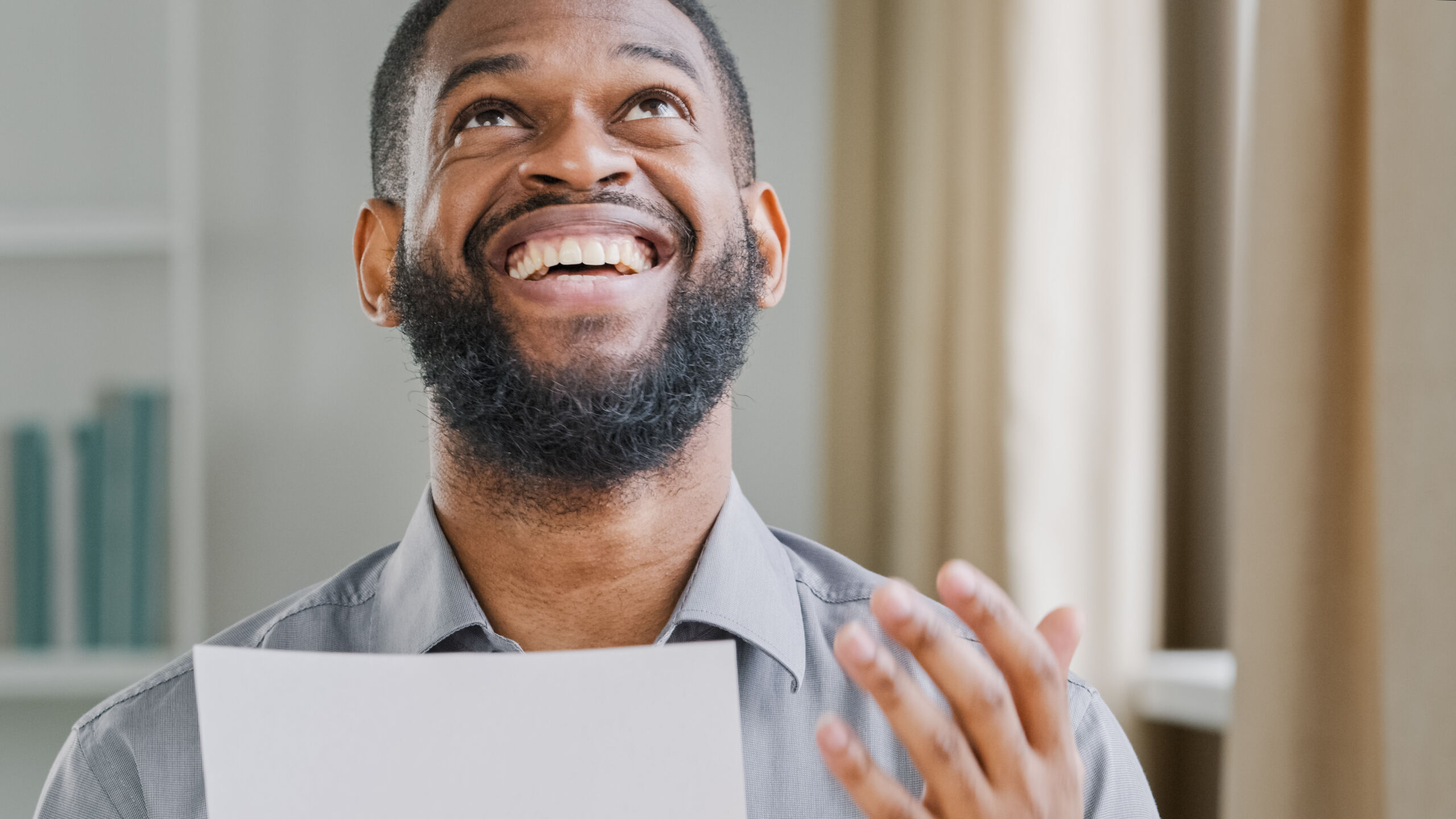 An image of a man who is happy because cloud cover does not negatively affect home solar panels?